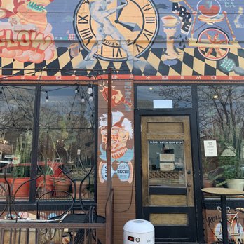 Pablo's Coffee - a clock on the side of a building - Coffee & Tea Near Me - Denver, Colorado