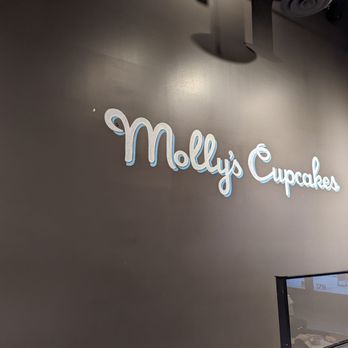 Molly’s Cupcakes - the logo on the wall - Desserts Near Me - Chicago, Illinois Molly’s Cupcakes - the logo on the wall - Desserts Near Me - Chicago, Illinois
