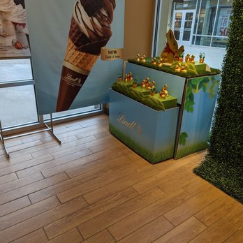 Lindt Chocolate Shop - a display of ice cream cones in a store - Chocolatiers & Shops Near Me - Asheville, North Carolina