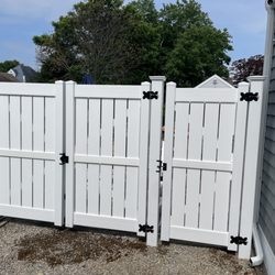 Wayside Fence - Buffalo style gate (front) with single person gate and large double gate.