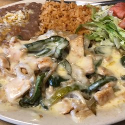 Arandas Mexican Grill - #8 Pollo chicken with onions, peppers, tomato covered in cheese with fresh tortillas, rice, beans and salad! I took half home with me...