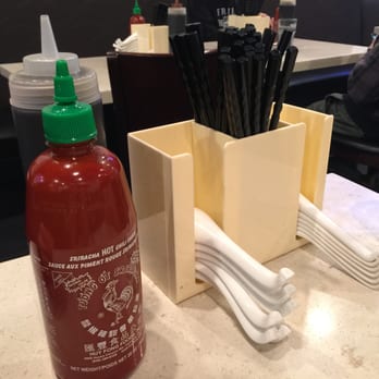 Pho Central - Hot sauce and utensils~ - Vietnamese Near Me - Vancouver, British Columbia