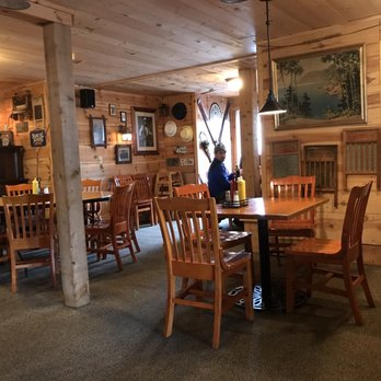 My Sister's Place - a dining room with a fireplace - American Near Me - Grand Marais, Minnesota My Sister's Place - a dining room with a fireplace - American Near Me - Grand Marais, Minnesota