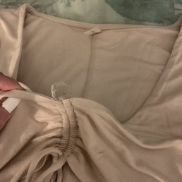 Cheap thin fabric...barely enough to cover your boobs. Sloppy loose threads.
