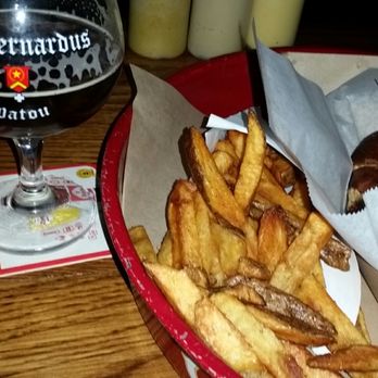 Wursthaus - St. Bernardus xmas Ale, veg. Apple & Sage sausage on pretzel roll with braised onions, & Belgian frites w Siracha sauce. - Pubs Near Me - Santa Ana, California Wursthaus - St. Bernardus xmas Ale, veg. Apple & Sage sausage on pretzel roll with braised onions, & Belgian frites w Siracha sauce. - Pubs Near Me - Santa Ana, California