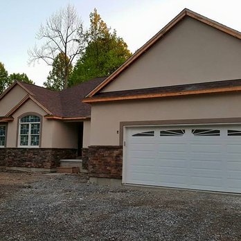 EKOVA Contracting - the front of a house with a garage - General Contractors Near Me - Niagara Falls, New York EKOVA Contracting - the front of a house with a garage - General Contractors Near Me - Niagara Falls, New York