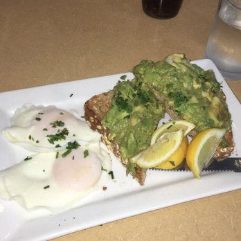 First Watch - Avocado toast & eggs. Multigrain blueberry pancakes in background - Cafes Near Me - Lady Lake, Florida First Watch - Avocado toast & eggs. Multigrain blueberry pancakes in background - Cafes Near Me - Lady Lake, Florida