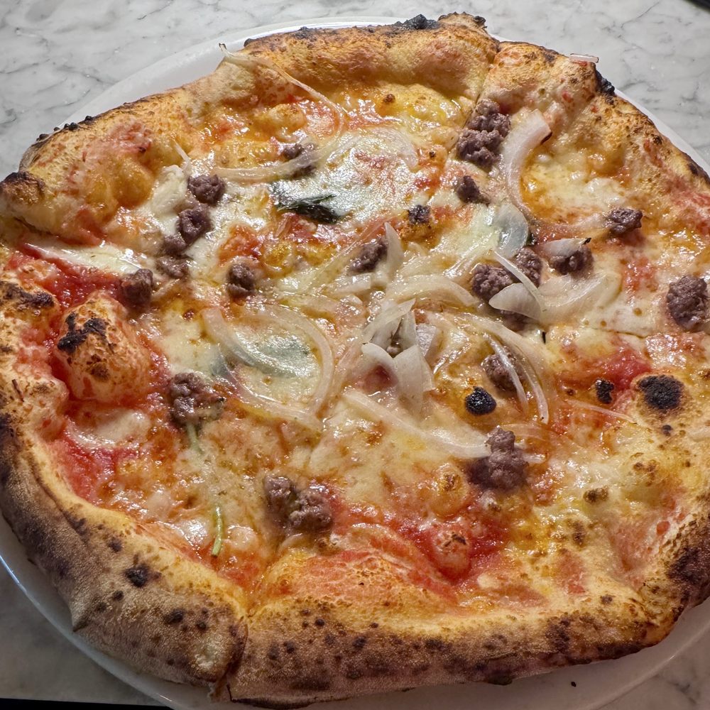 Medium BELLILLO pizza.  Made with tomato mozzarella, prime Angus beef minced, onion, basil, extra virgin oil.