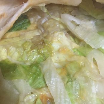 Taco Bell - Brown/grey mush they scooped into my crunchwrap. - Fast Food Near Me - Granada Hills, California