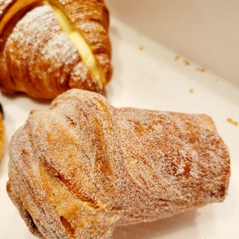 Cremcrittos - Black Tea Cruffin.. is shaped like a tall top hat, cinnamon sugar outside, croissant texture inside with a delicious creamy filling. - Bakeries Near Me - McKinney, Texas