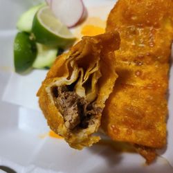 La Colonial Supermercado y Taqueria - Birria egg rolls. Crust a tad greasy. The limes added a nice touch to it.