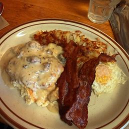 Biscuits and gravy, over easy egg, side of bacon, and hashbrowns Biscuits and gravy, over easy egg, side of bacon, and hashbrowns