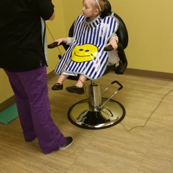 Enchanted Forest Pediatric Dentistry - Wearing her "superhero" cape!
