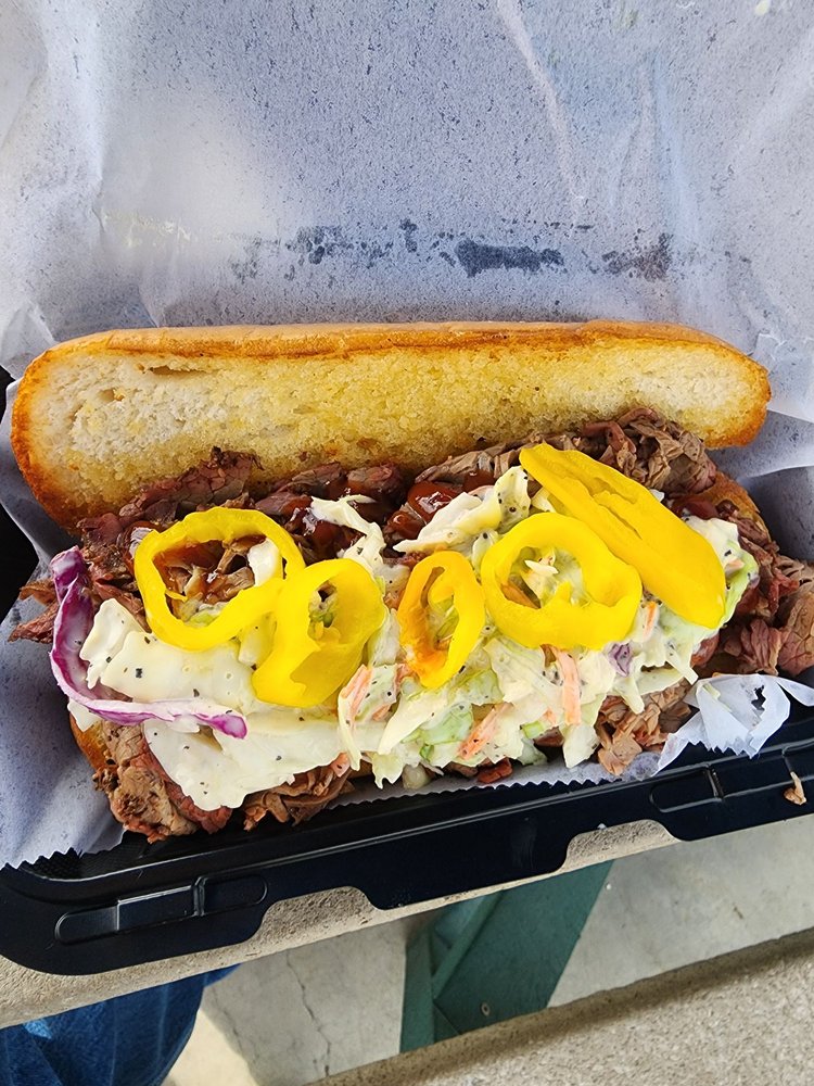 Sabor Taino Smokehouse BBQ Logo