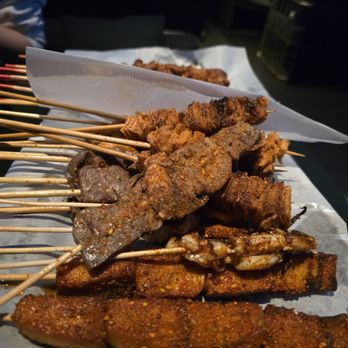 XINJIANG BBQ - Assortment of chicken skin, squid tentacles, fish sausage, and chicken heart - Barbeque Near Me - Monterey Park, California XINJIANG BBQ - Assortment of chicken skin, squid tentacles, fish sausage, and chicken heart - Barbeque Near Me - Monterey Park, California