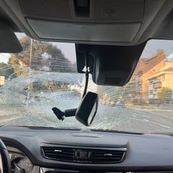 Los Angeles Police Department - My shattered front windshield w/broken rearview mirror- making it dangerous to drive home.