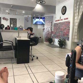 Champagne Nails - They have a wonderful color selection, that's only one wall there is another !! - Nail Salons Near Me - San Marcos, California