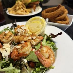 Old Orange Cafe & Catering - Grilled shrimp salad and blue cheese burger Side of excellent onions and very good fries.