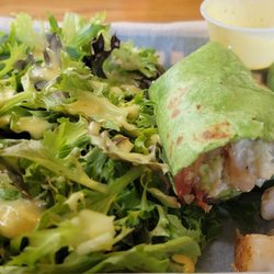Sweet Magnolias Cafe & Bakery - Chicken Wrap and Side greens . I could eat this 3 times a week.