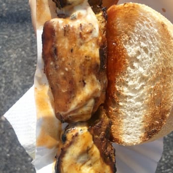 Pinchomania - a person holding a sandwich and a cup of coffee - Food Stands Near Me - Orlando, Florida Pinchomania - a person holding a sandwich and a cup of coffee - Food Stands Near Me - Orlando, Florida