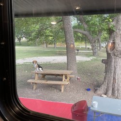 Rio Frio RV Park And Campground - View of the tree covered spaces.