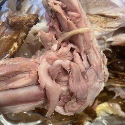 a close up view of a roasting chicken a close up view of a roasting chicken