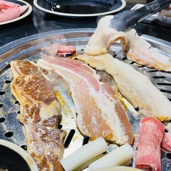 YOON Korean BBQ - a variety of meats on a grill - Korean Near Me - Carrollton, Texas