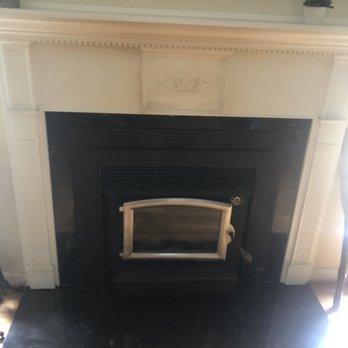 Rowan Chimney Works - New zero clearance Buck wood stove with marble surround and hearth pad - Chimney Sweeps Near Me - Salisbury, North Carolina