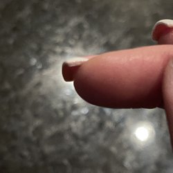 Tipsy Salonbar  Midtown Tampa - Nails not fully covered in dip powder or paint.