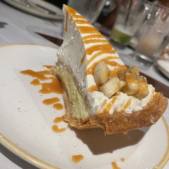 Monkeypod Kitchen - Banana Cream Pie Tahitian vanilla pastry cream, local apple banana, tahitian vanilla whipped cream, caramel, homemade pie crust - Tacos Near Me - Honolulu, Hawaii Monkeypod Kitchen - Banana Cream Pie Tahitian vanilla pastry cream, local apple banana, tahitian vanilla whipped cream, caramel, homemade pie crust - Tacos Near Me - Honolulu, Hawaii