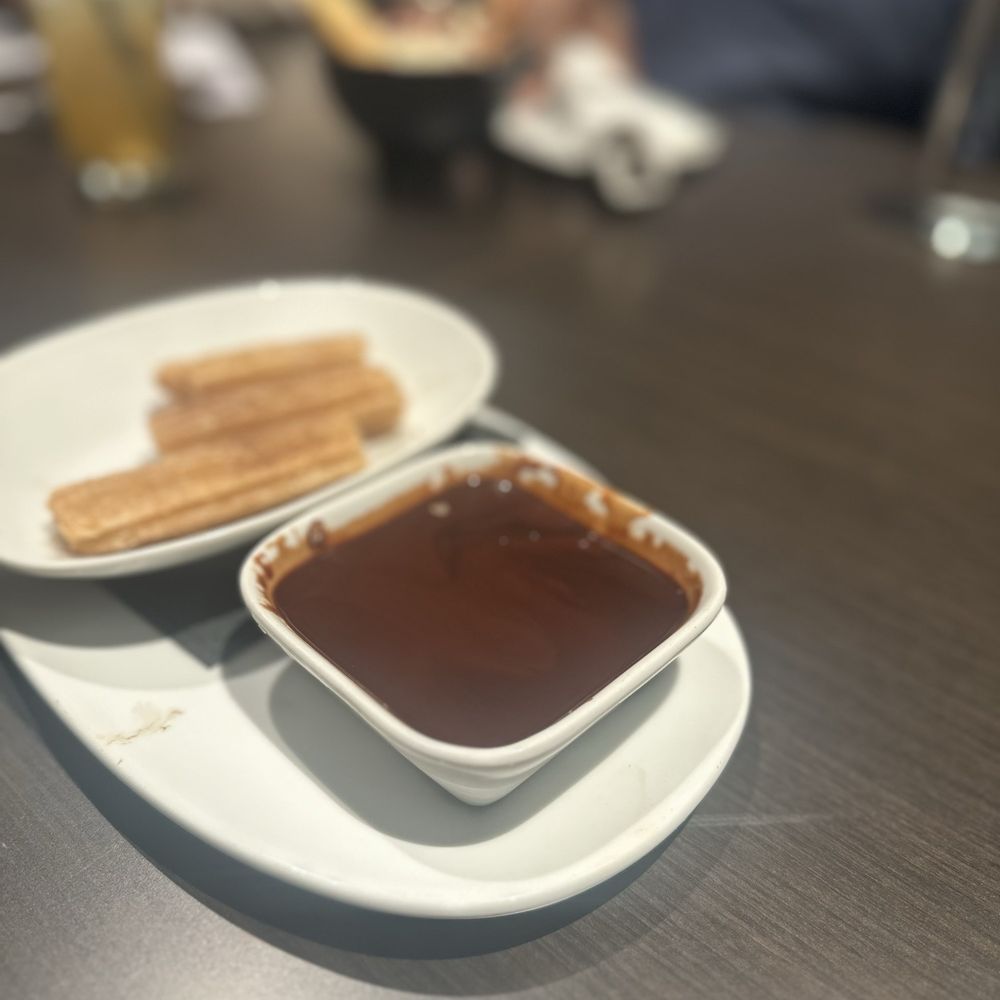 Lavender Rooftop Kitchen & Bar - Half eaten churros and chocolate sauce - Wine Bars Near Me - Savannah, Georgia