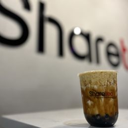 a cup of coffee on a table a cup of coffee on a table
