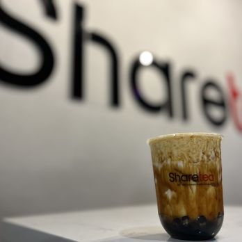 Sharetea - a cup of coffee on a table - Bubble Tea Near Me - Hillsboro, Oregon Sharetea - a cup of coffee on a table - Bubble Tea Near Me - Hillsboro, Oregon