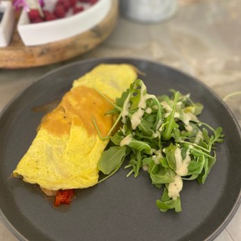 Parc - Creole shrimp omelet with arugula salad - New American Near Me - Detroit, Michigan Parc - Creole shrimp omelet with arugula salad - New American Near Me - Detroit, Michigan