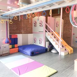 Downtown Kids Therapy - Our Tribeca Sensory gym space has a "castle" with a slide, a rock wall, a zip line, and plenty of sensory swings!