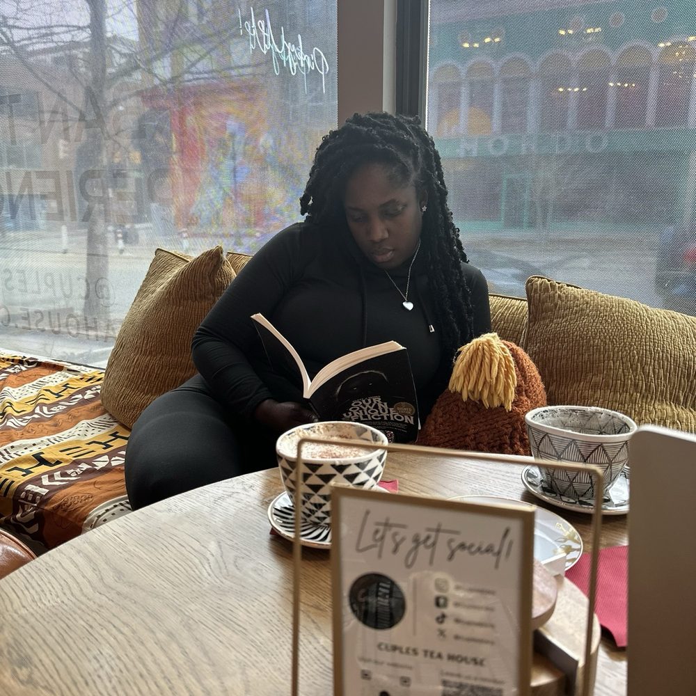 Reading my book and sipping tea