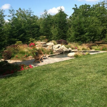 D&J Landscape Management - a garden with a pond and waterfall - Landscaping Near Me D&J Landscape Management - a garden with a pond and waterfall - Landscaping Near Me