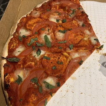 Mangiamo Pizza - a slice taken out of the box - Pizza Near Me - Aptos, California Mangiamo Pizza - a slice taken out of the box - Pizza Near Me - Aptos, California