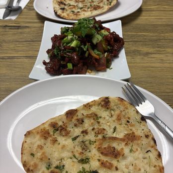 The indian Bistro - Garlic Naan (2 PCS) chicken 65 - Indian Near Me - Arcade, New York The indian Bistro - Garlic Naan (2 PCS) chicken 65 - Indian Near Me - Arcade, New York