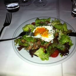 Salad with poached egg and bacon. Salad with poached egg and bacon.