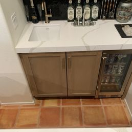Bar sink, faucet, hidden Scotsman ice maker, beverage cooler. Bar sink, faucet, hidden Scotsman ice maker, beverage cooler.