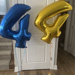 Party Place - The store employee REFUSED to put a second string on the gold 4 so it will not stand up straight. We got a 4 somewhere else.