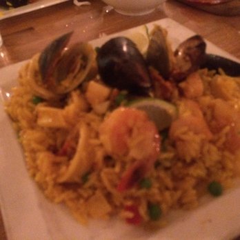 Entretapas - Paella is plated. - Spanish Near Me - Weston, Florida