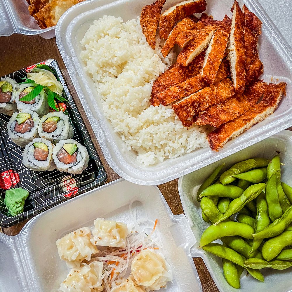 a variety of asian food in plastic containers a variety of asian food in plastic containers
