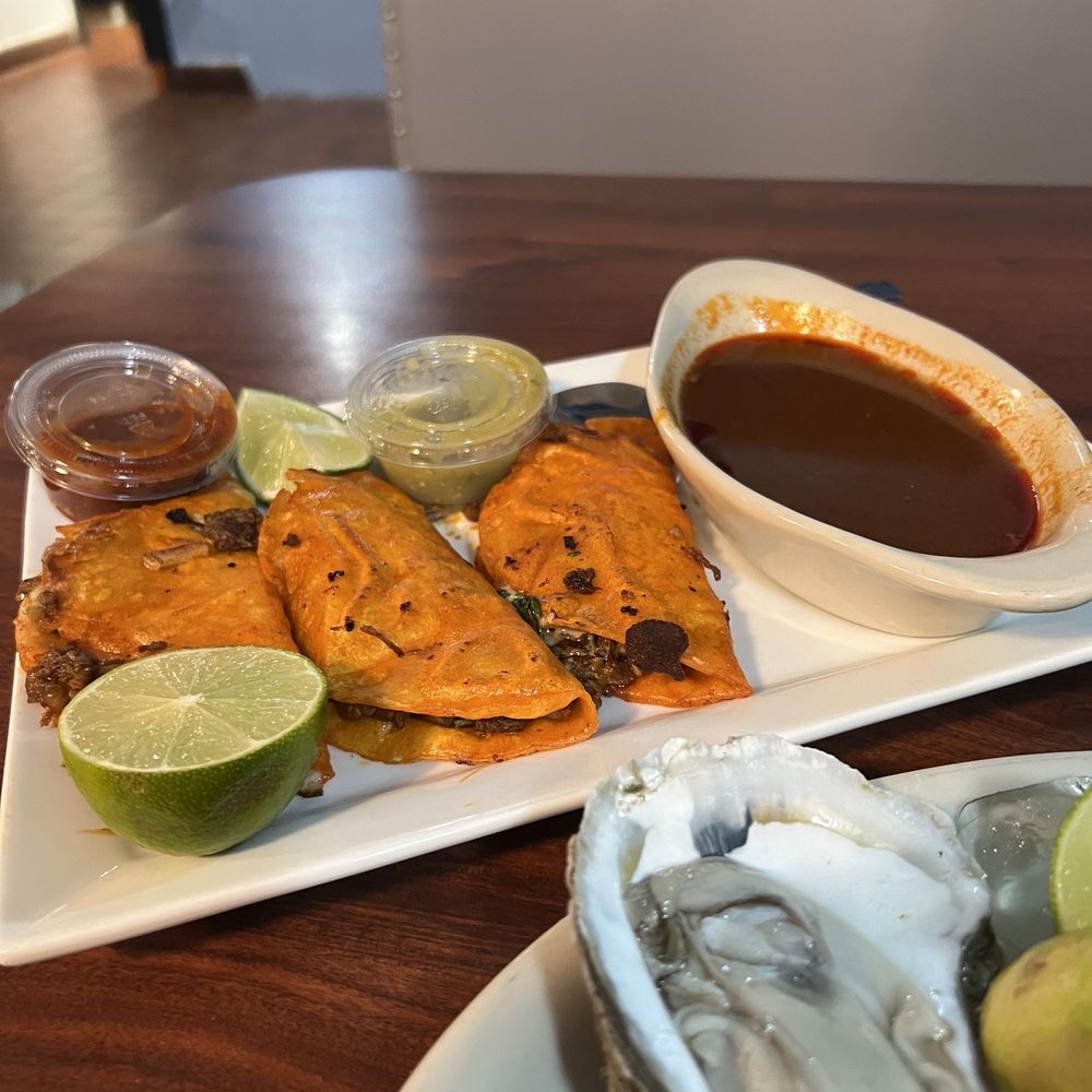 Mariscos Los Plebes - Tacos birria with consommé and oysters for my appetizer - Mexican Near Me - Muncie, Indiana