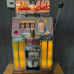 R and H Novelty and Antique Slot Machines and Antiques - 1947 jennings sun cheif 25 cent antique slot machine completley restored