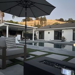 Unique Concrete Creations - Patio cover, outdoor kitchen, bluestone, concrete patio, turf