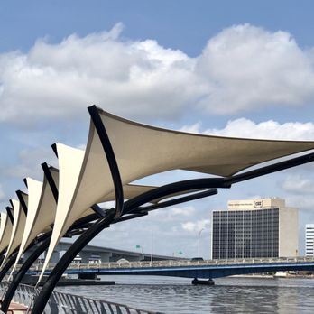Graffiti American Burger Bar - a row of shade sails on a bridge over a river - Cafes Near Me - Jacksonville Beach, Florida Graffiti American Burger Bar - a row of shade sails on a bridge over a river - Cafes Near Me - Jacksonville Beach, Florida