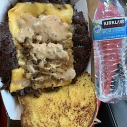 Double smile smash burger. Water bottle for scale. Halal meat ! Double smile smash burger. Water bottle for scale. Halal meat !