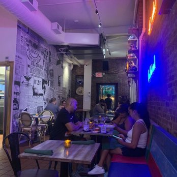 Pico De Gallo Bar & Kitchen - Indoor Seating area and you can see through the back door to the garden area - Mexican Near Me - New York, New York
